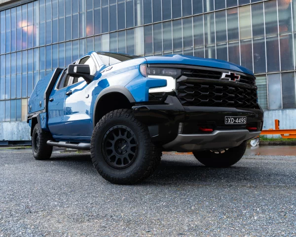 Blue Silverado Custom Tray and Canopy Front Grill View