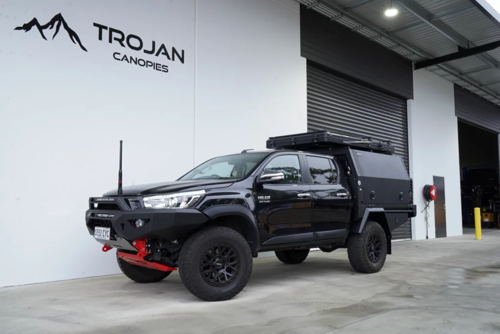 Black Toyota Hilux with Trojan Canopies tray and canopy package