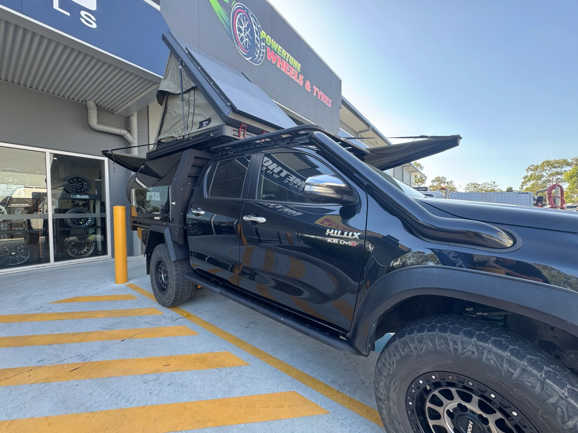 Black Hilux with Trojan Tray and Canopy