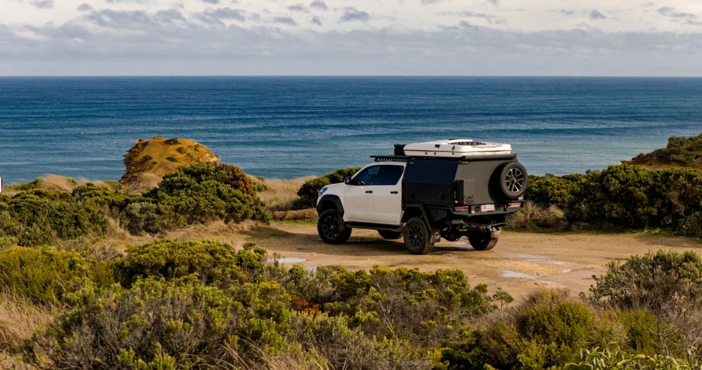 White Hilux with Trojan Canopies setup and rooftop tent